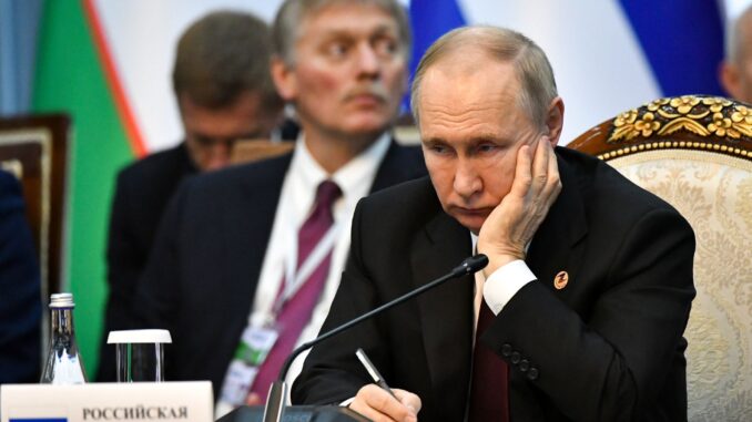 путін